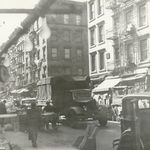 "Street Market, Lower East Side. Clogged street traffic, carts, customers. 1941."